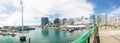 Panoramic Cityscape view of Darling harbour, the image was taken from the Pyrmont bridge in the cloudy day.